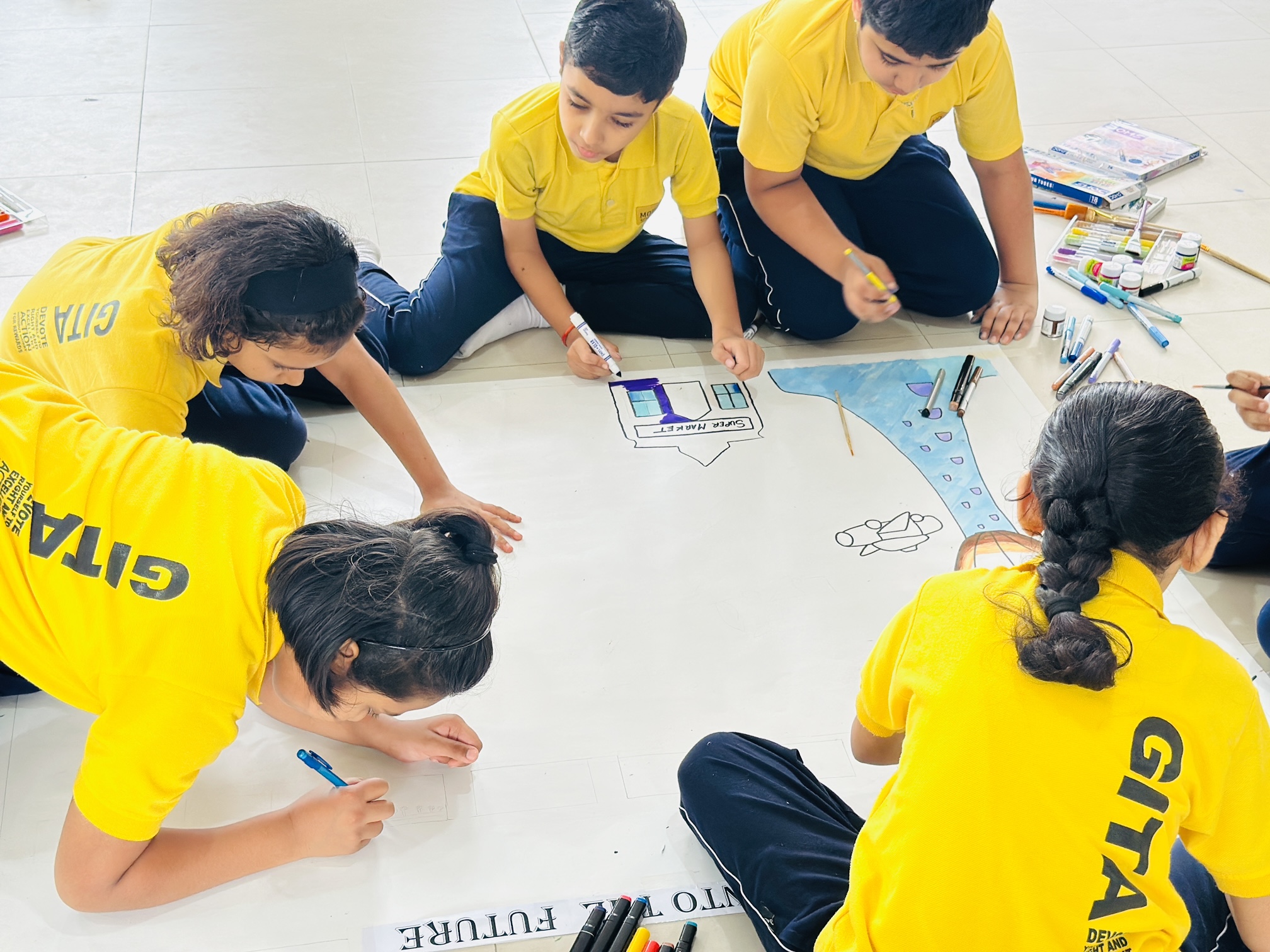 Gita House students preparing their group canvas for the Inter-House Art Competition, Soulful Art 2026
