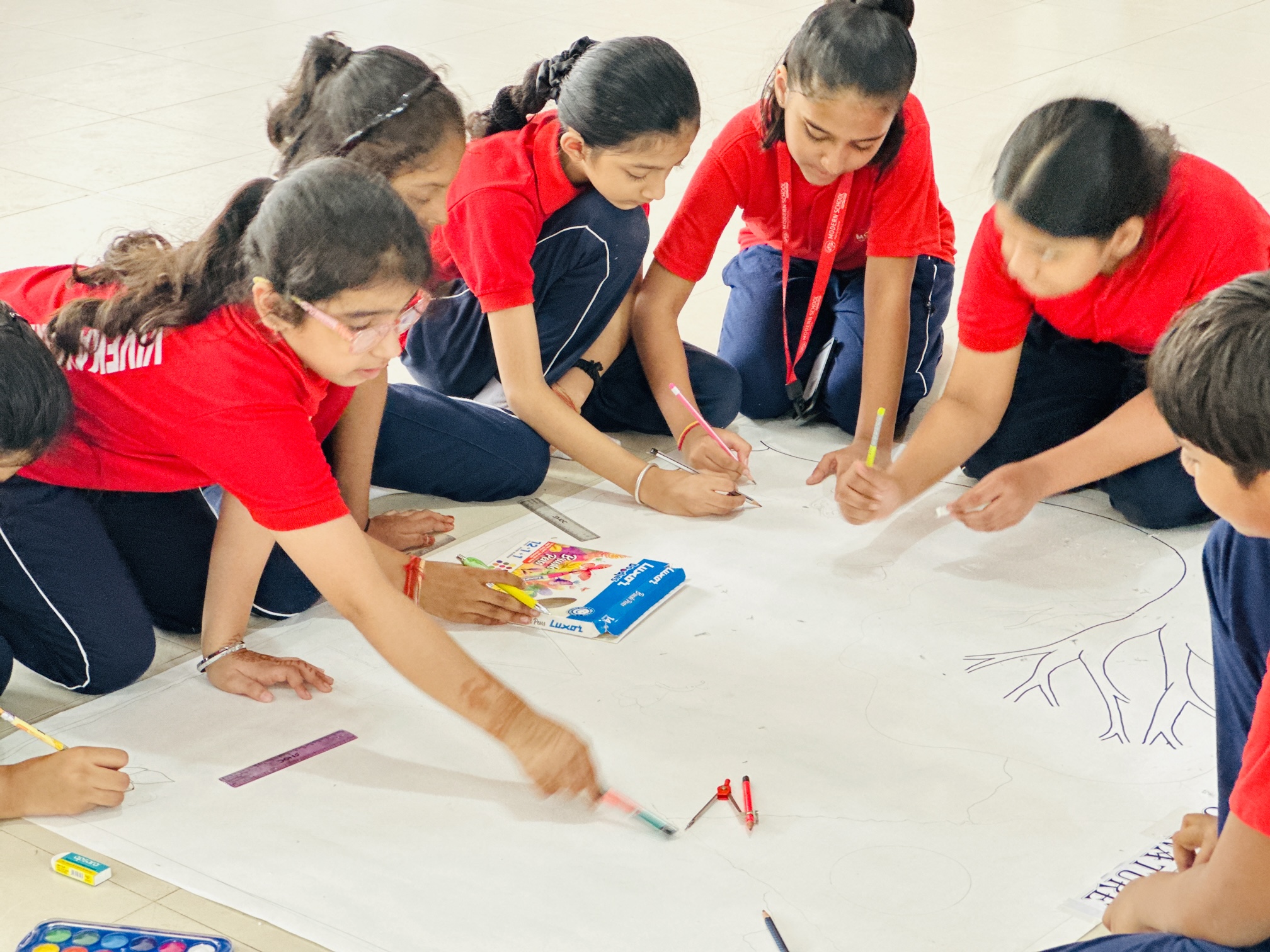 Vivekananda House students working on their canvas during the Inter-House Art Competition